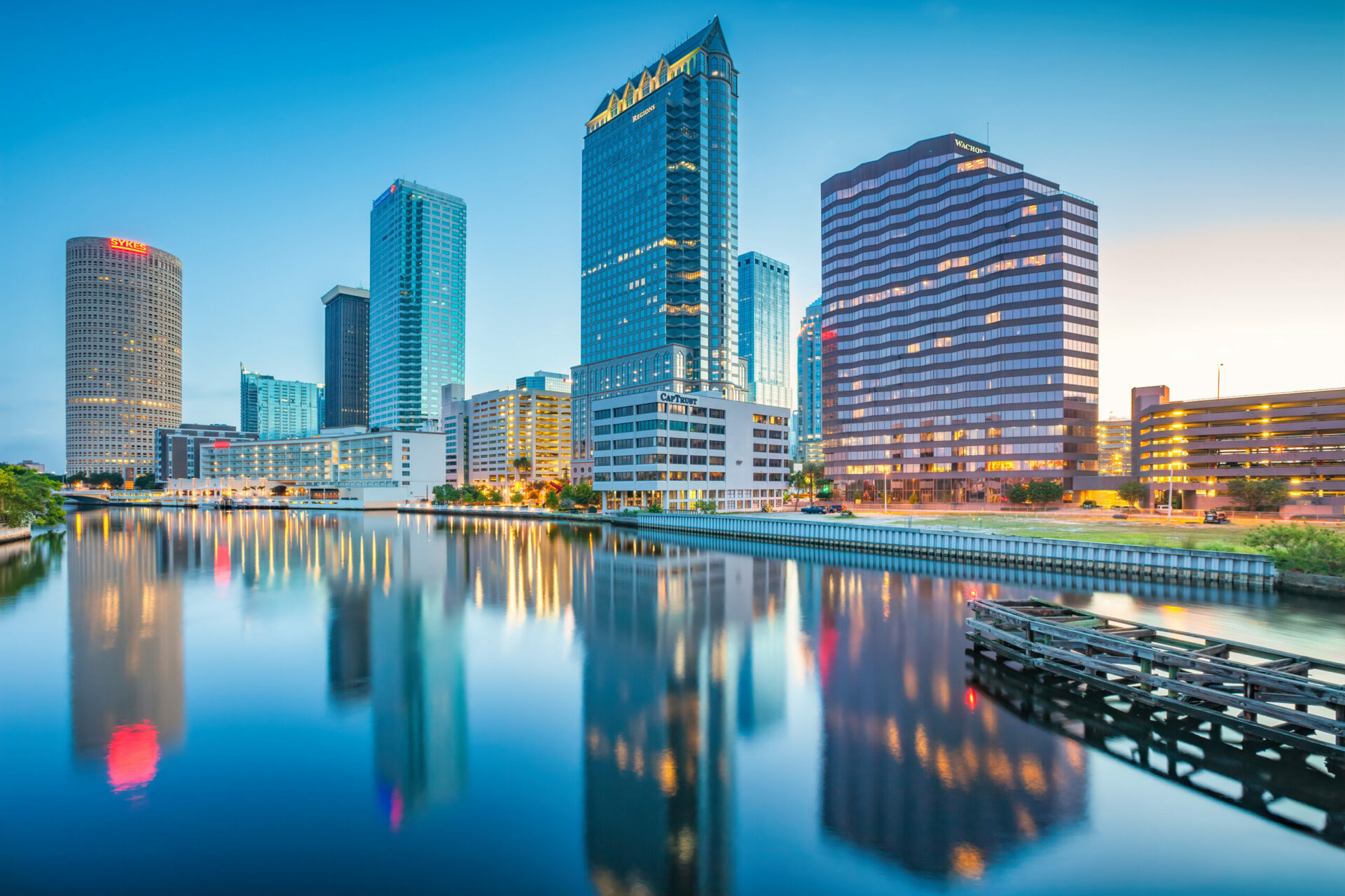 Skyline of downtown Tampa Florida USA and the Hillsborough River at twilight blue hour.